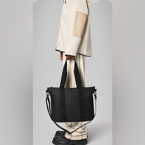 Brand new never used Rains tote bag mini in black